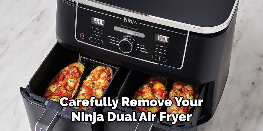 Carefully Remove Your
Ninja Dual Air Fryer