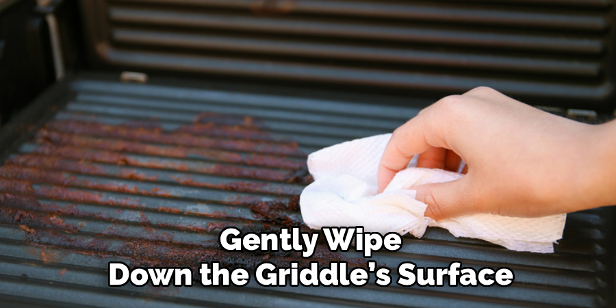 Gently Wipe Down the Griddle’s Surface