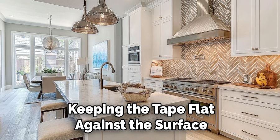 Keeping the Tape Flat Against the Surface