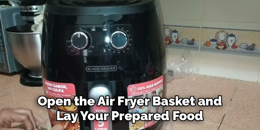 Open the Air Fryer Basket and
Lay Your Prepared Food