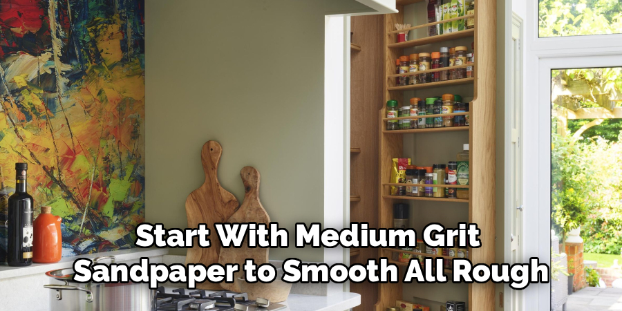 Start With Medium Grit 
Sandpaper to Smooth All Rough